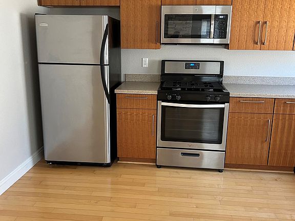 Stainless appliances and custom bamboo cabinets upgrade this kitchen