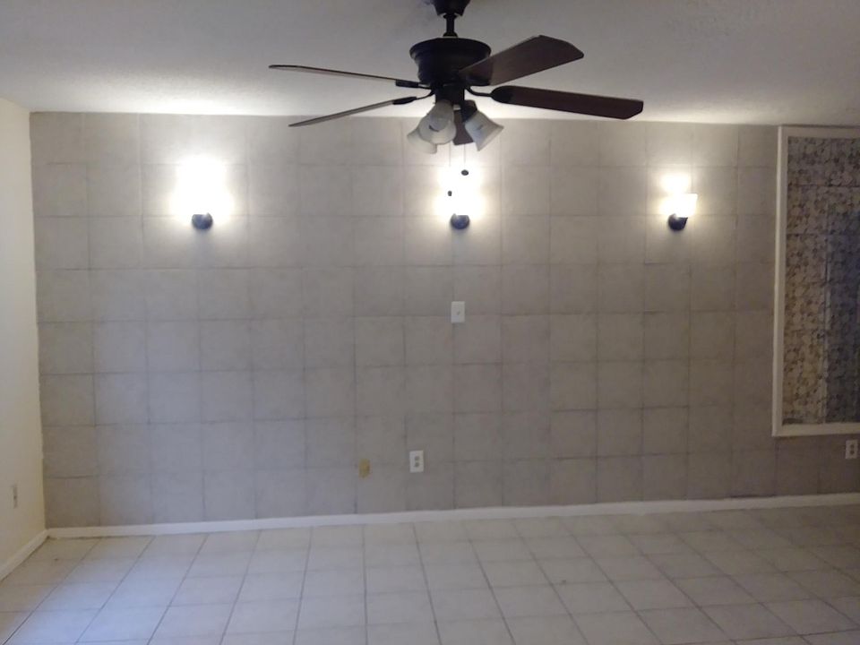 Front room with ceramic tile floors and walls