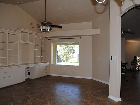 Built-in office desk, shelves, file cabinets.