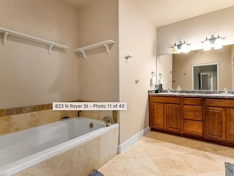 Primary bath has double vanities, soaking tub, walk-in oversize shower, toilet room.