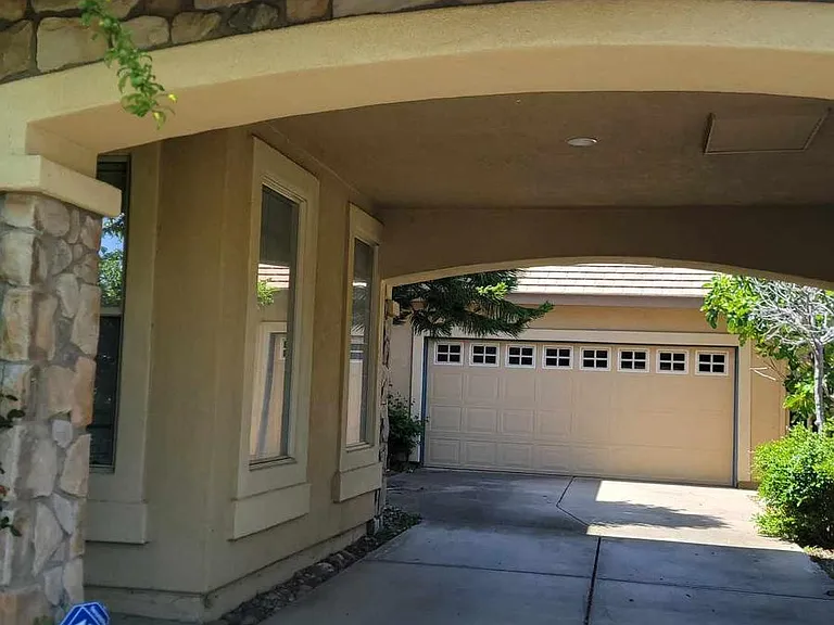 Partially covered driveway provides shade