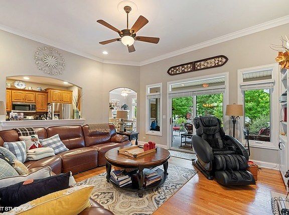 Gleaming hardwood floors, crown molding, ceiling fan and light!