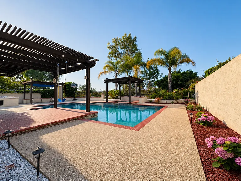 Resort-style Bali-inspired backyard, pool and jacuzzi