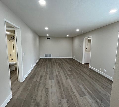 Move in ready! Freshly painted, new vinyl laminate flooring, recessed lights.