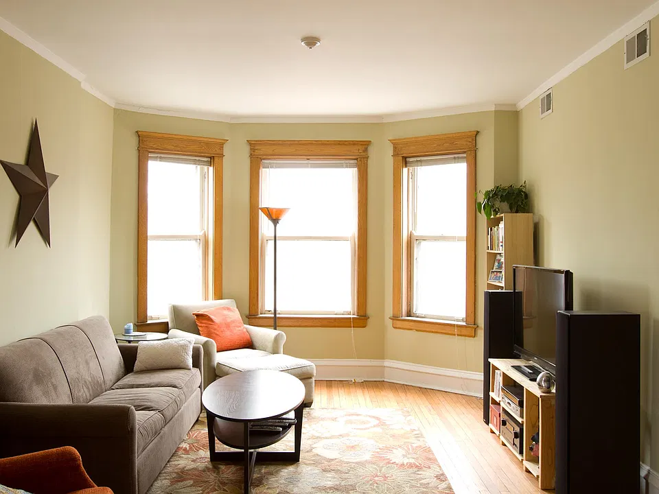 Main living space with southern exposure bay windows