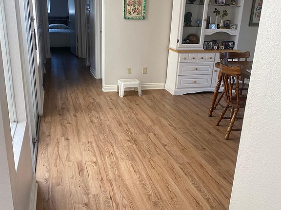 hallway with partial view of dining room