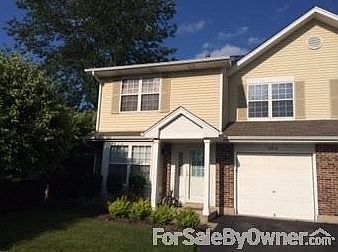 Front of Unit : New, custom landscaping. Front yard and driveway opens to largest parking lot.
