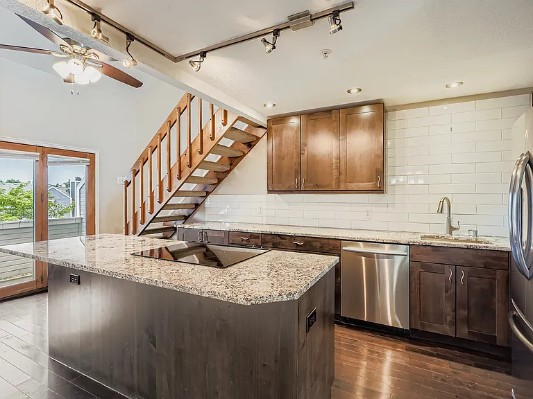 Oversized, light-filled kitchen built for cooking and entertaining, with 8-foot island and 22 feet of counters.