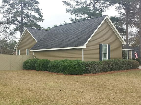 Side view with fenced side yard in view