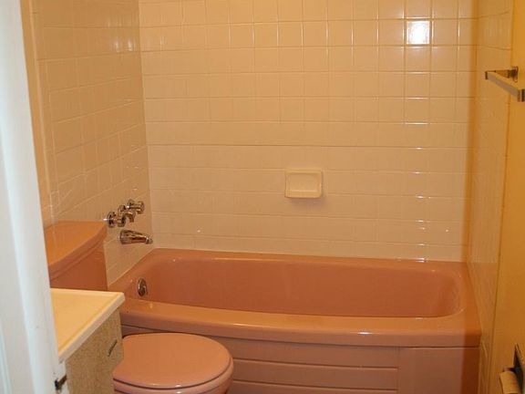 bathroom with vintage fixtures and new flooring