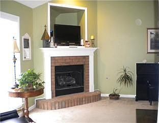 Gorgeous fireplace w/ TV space and vaulted ceilings in Living room