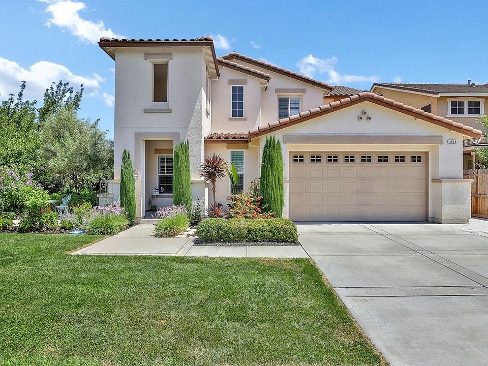 Spacious and inviting Village One 5 bedroom, 3.5 bath home featuring a first floor suite plus a beautiful pool and spa with wate