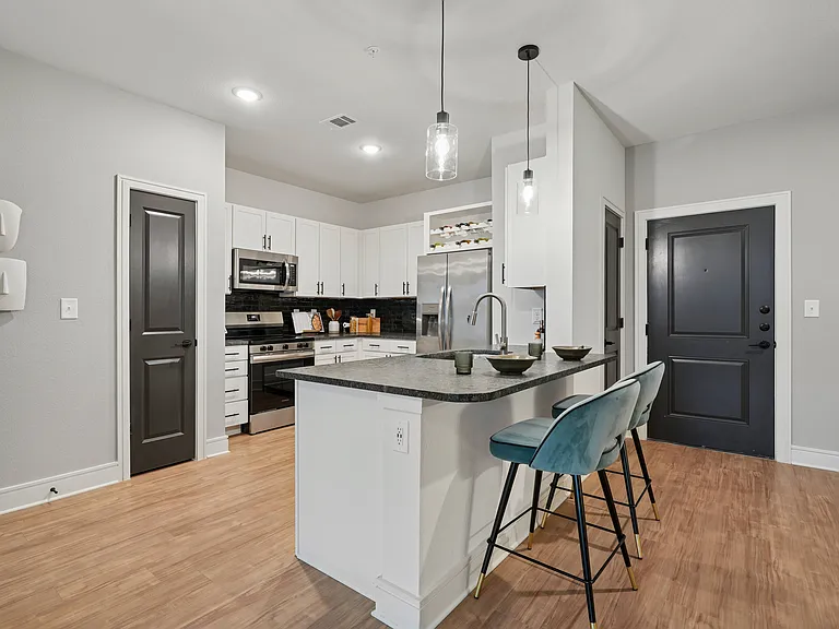 Kitchen with Granite Countertop and Stainless Steel Appliances.