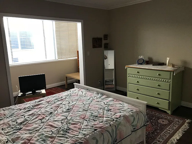 Spacious bedroom with special "nook" that allows wonderful sunshine into the room. A great reading spot.