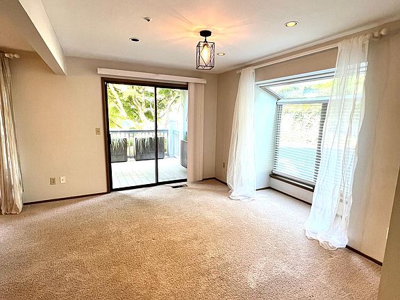 Extra living space on main floor with sliding doors out to private deck.