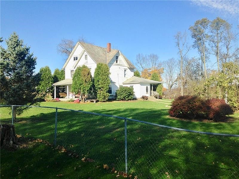3 story Farmhouse, beautiful woodwork, 8 acres, pond, barn and garage