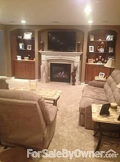 Downstair family room
						:
						Fireplace with built-in lighted shelves