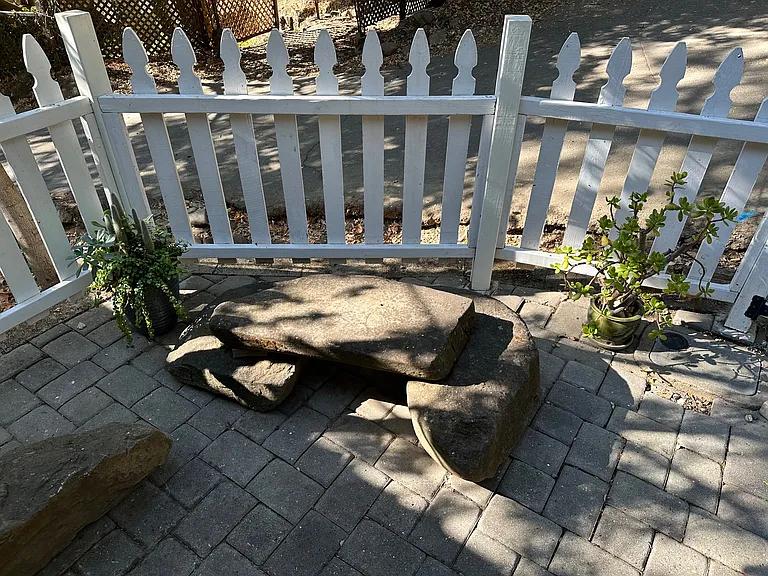 Natural boulder bench in the front