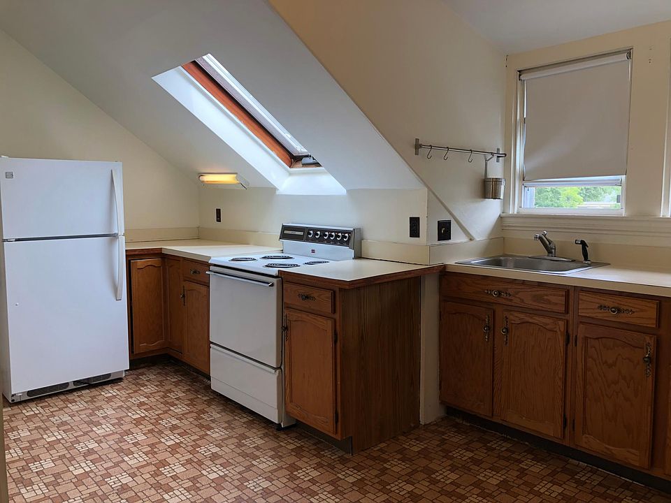Kitchen with skylight and electric stove