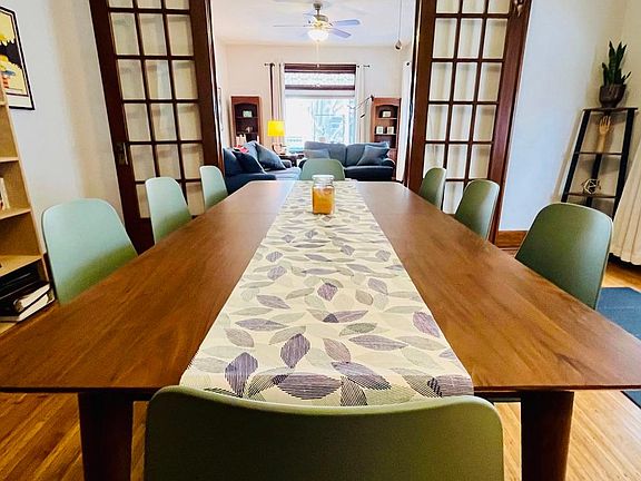 dining room table looking into living room and porch