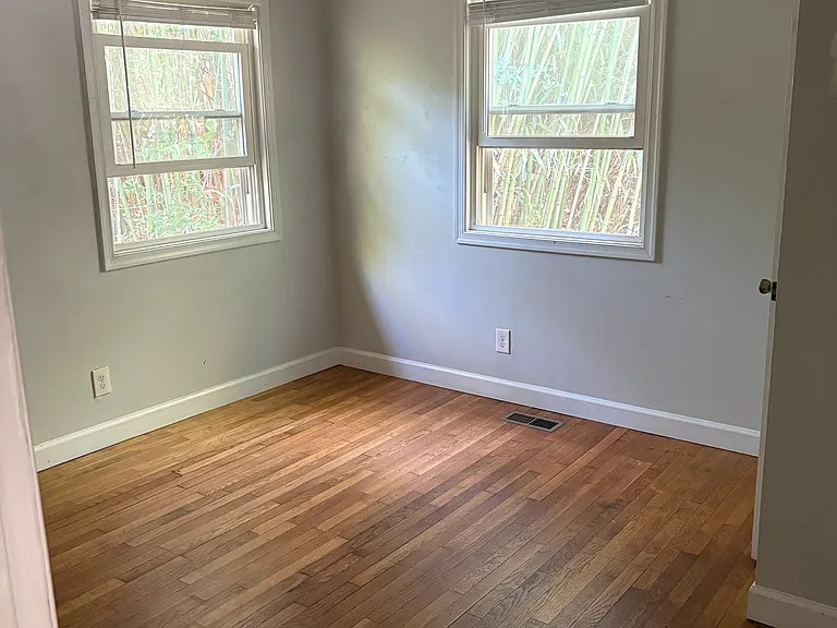 bedroom 2, approx. 11 1/2 x 10 1/2 ft, including closet. Both bedrooms overlook the back yard with its bamboo-shaded patio