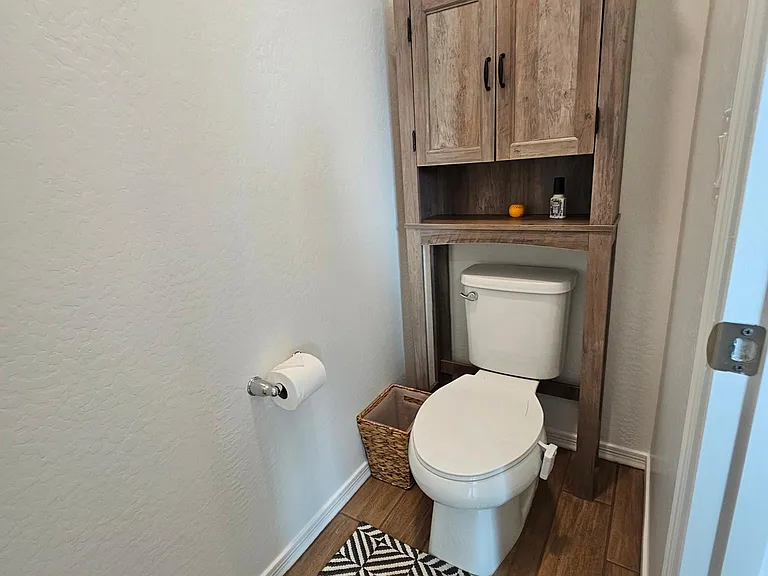 Primary bathroom, separate toilet area