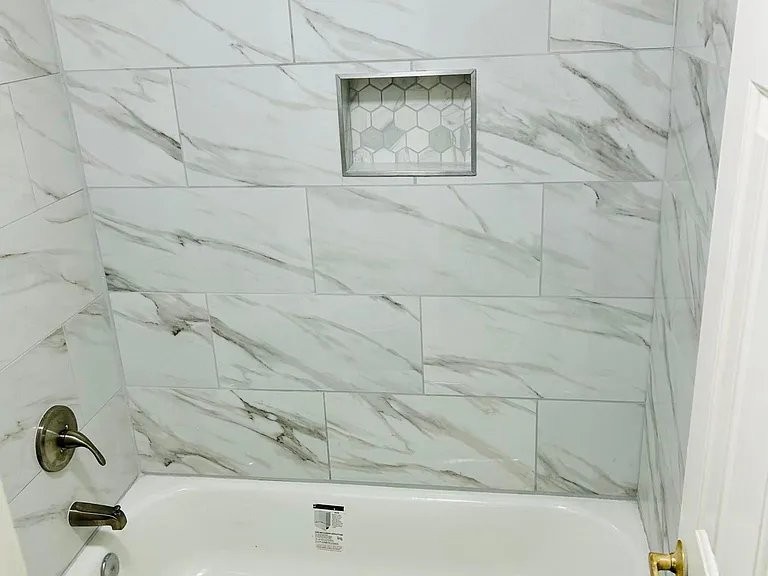 New bath tubs, new tiles around bathtubs, new faucets, new toilets