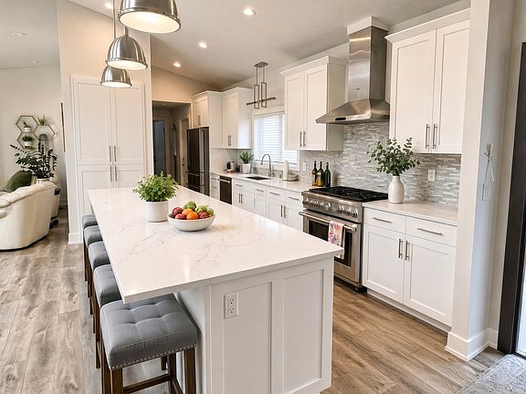 Open kitchen with pantry and ample storage.
