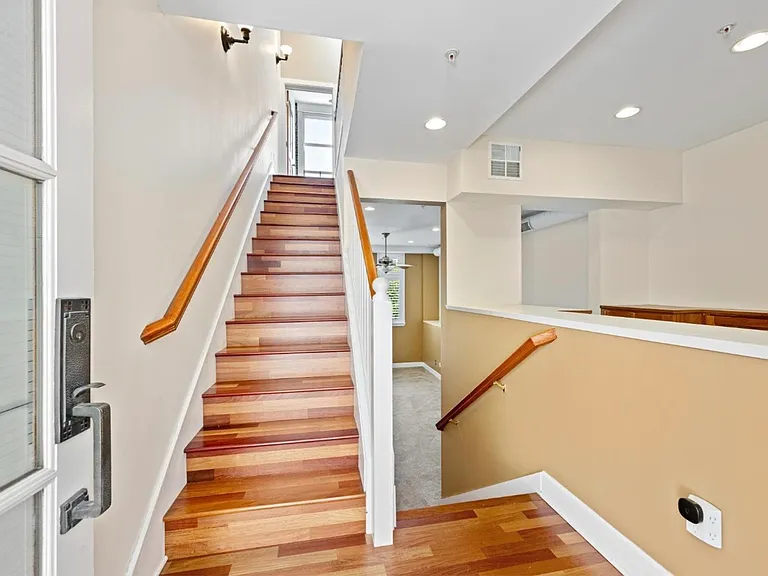 Staircase from main level to upper level and bedrooms