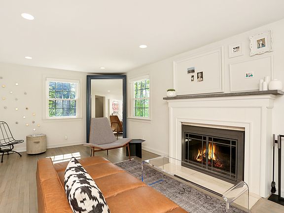 Living room with beautifully refinished fireplace 