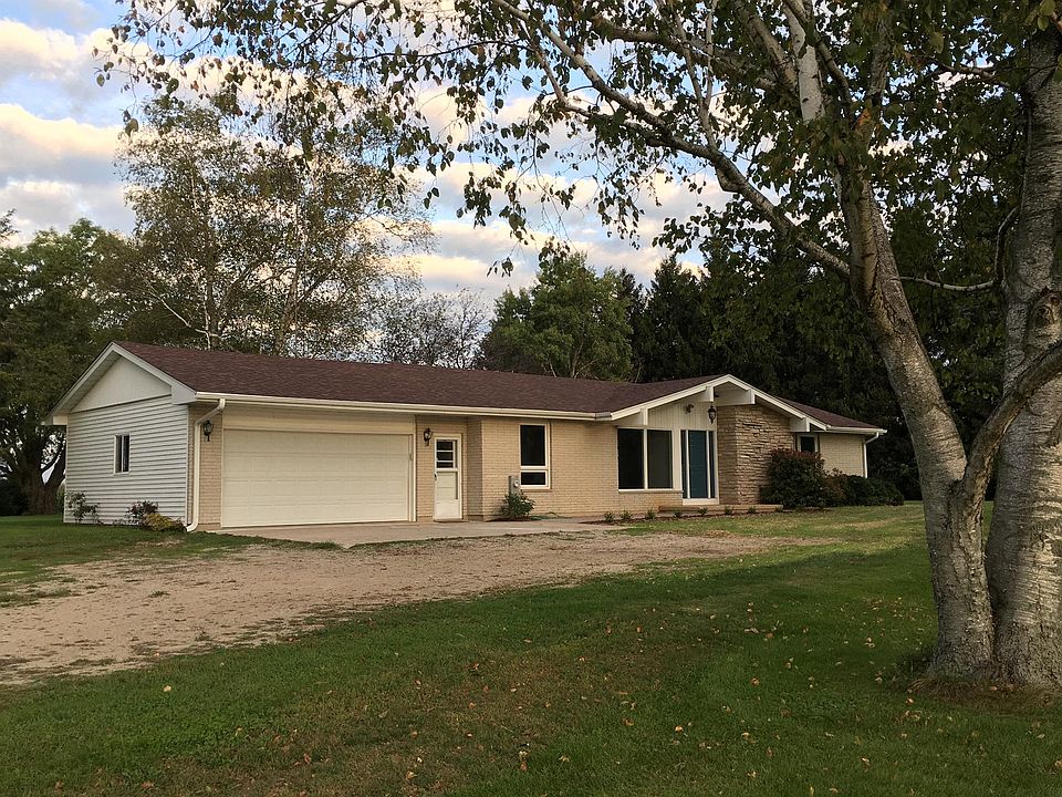 Country Gem with large 2 car garage and a great tree lined yard.