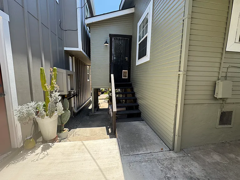 Security screened backdoor with access to patio.