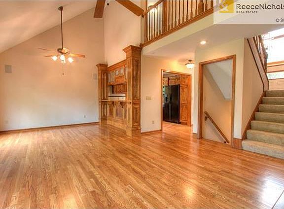 This is the living room looking into the dining room, kitchen and upstairs loft