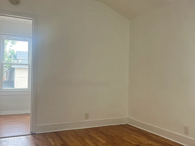 Master bedroom and entrance into walk-in closet