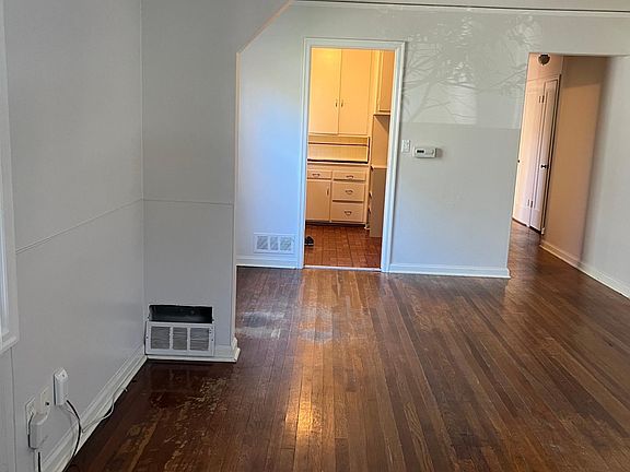 View of dining room and kitchen from the front door