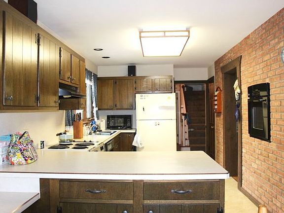The country-sized kitchen features loads of cabinet and counter space, and new flooring, plus a handy butlers pantry between the kitchen and dining room! This room is 26x13!