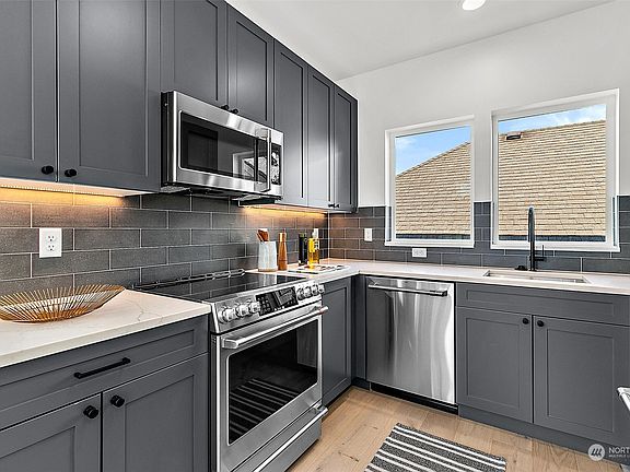 Dishwasher upgraded to a convenient two-drawer model, offering flexible loading options.