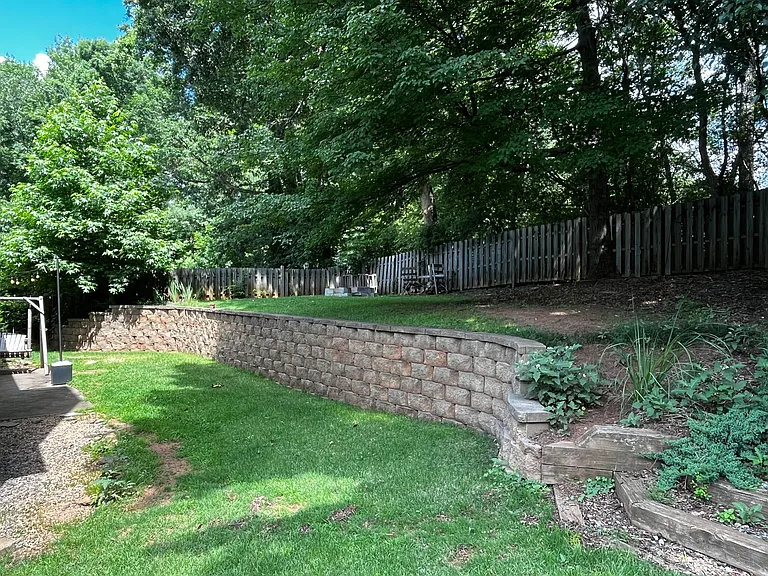Fenced backyard with patio.
