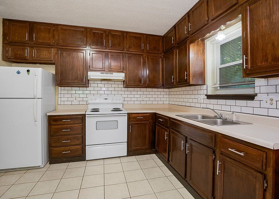 refrigerator, stove, sink, tons of cabinet space and countertop space for microwave