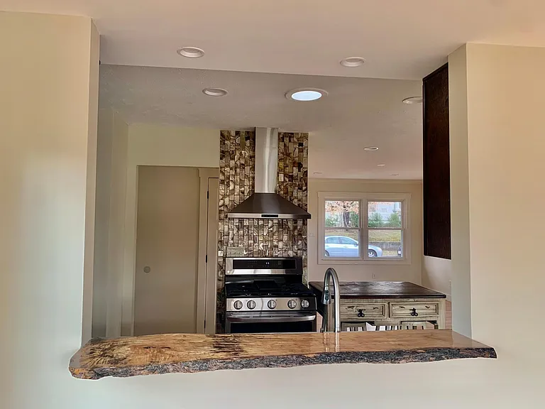 Kitchen with opening to dining area