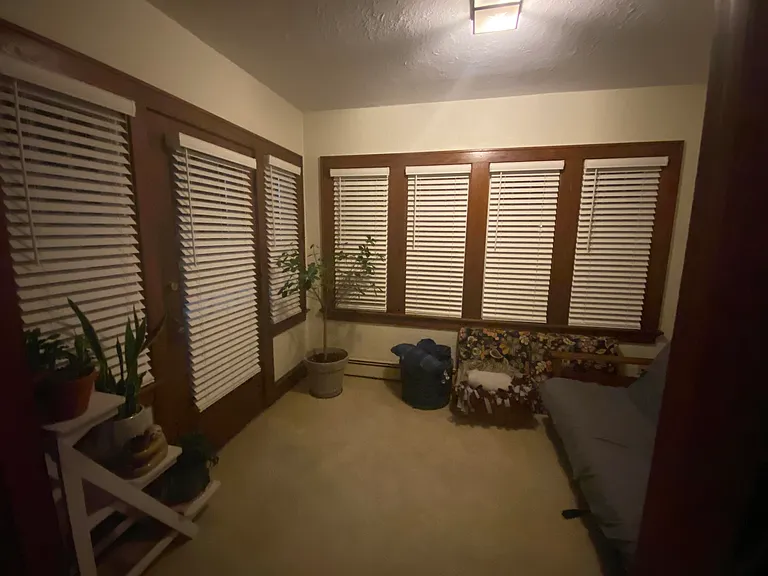 Sunroom with all new blinds from living room