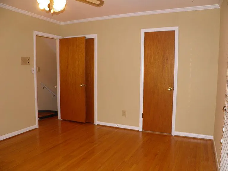 Upper level bedroom with closet and access to bathroom.
