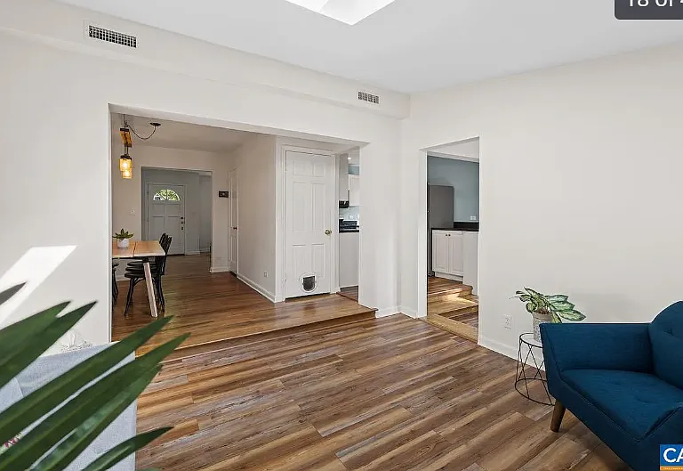 view of dining room and kitchen from sitting room with fireplace