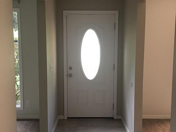 Entrance hall with Living Room to the left and Dining Room to the right.