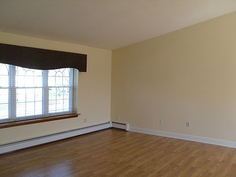 Family Room is bright and open and has cathedral ceilings
