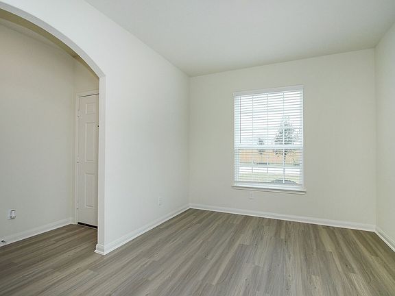 The dining room is located in the front of the home right off the kitchen.
