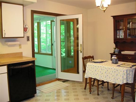 For added convenience this eat-in kitchen offers sliders to a sunroom