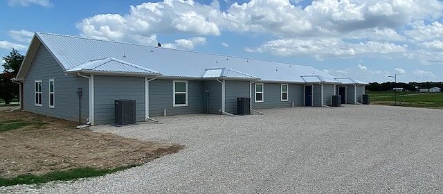 Rear of Quadplex with parking for 2 vehicles at each unit.