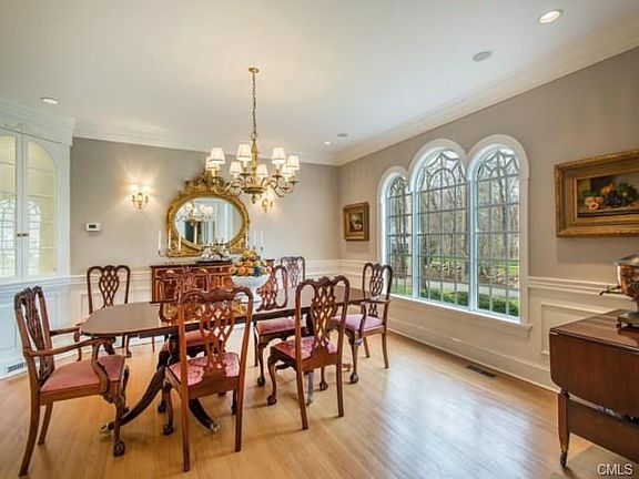 Formal Dining Room with two side built-ins and hardwood flooring