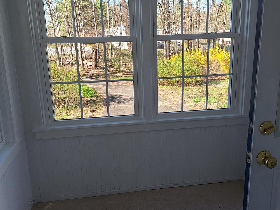 Enclosed sunroom overlooking side yard